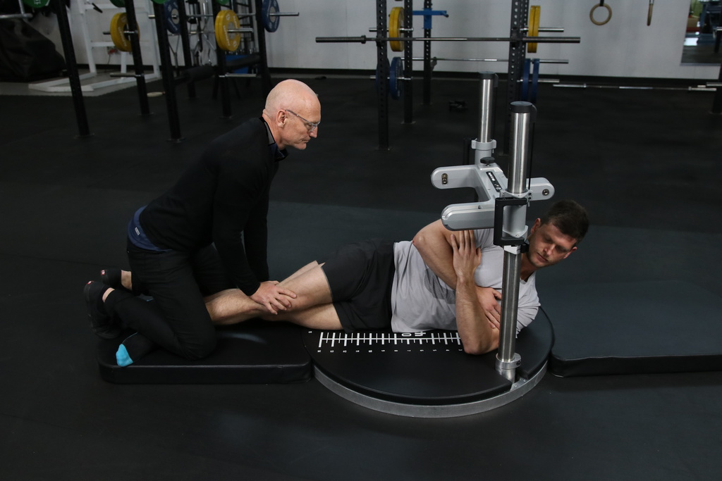 Kangatech strength testing technology measuring a patient's hip strength in a physiotherapy clinic